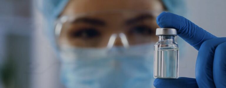 Holding a Vial in a Laboratory